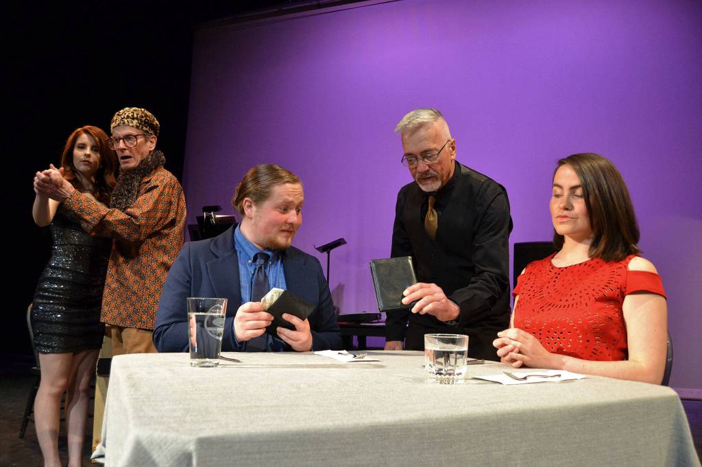 One of the biggest questions in a date is who will take the check. Here, Aaron (Austin Krieg) considers paying the bill to waiter Greg Scherer for the meal with Casey (Emma Jane Garcia) in OTAs First Date. Sequim Gazette photo by Matthew Nash
