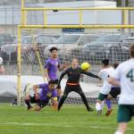 Sequim defenders Rudy Franco (16) and Brandon Benson (12) and goalkeeper Navy Thomas-Brenske defend the Wolves goal in the first half of a 1-0 Sequim win over rival Port Angeles on April 9. Sequim Gazette photo by Michael Dashiell