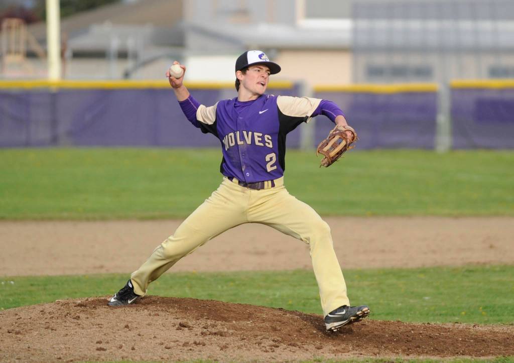 Sequims Joey Oliver throws in relief of teammate Silas Thomas against Port Angeles on April 19. Sequim Gazette photo by Michael Dashiell