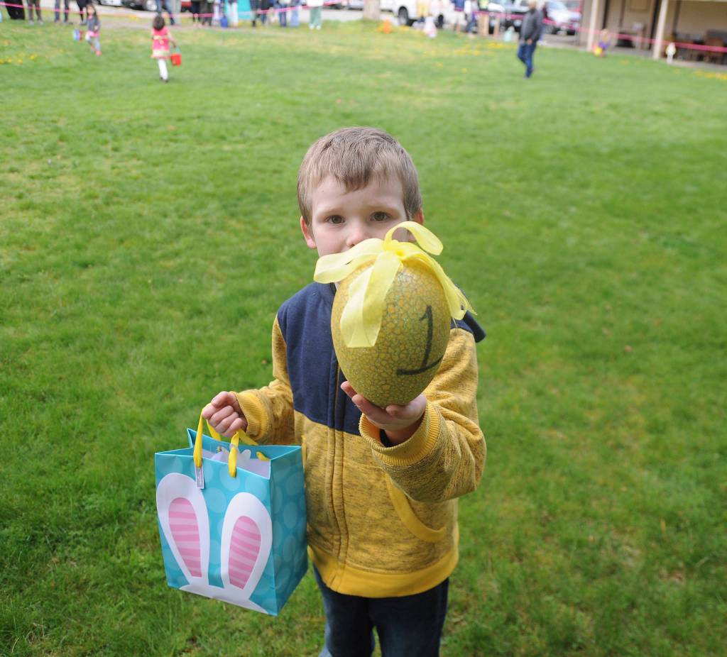 Vaughn McCarter, 5, shows off his rare golden egg prize at the Sequim Elks Lodge Easter Egg Hunt on April 20. Sequim Gazette photo by Michael Dashiell