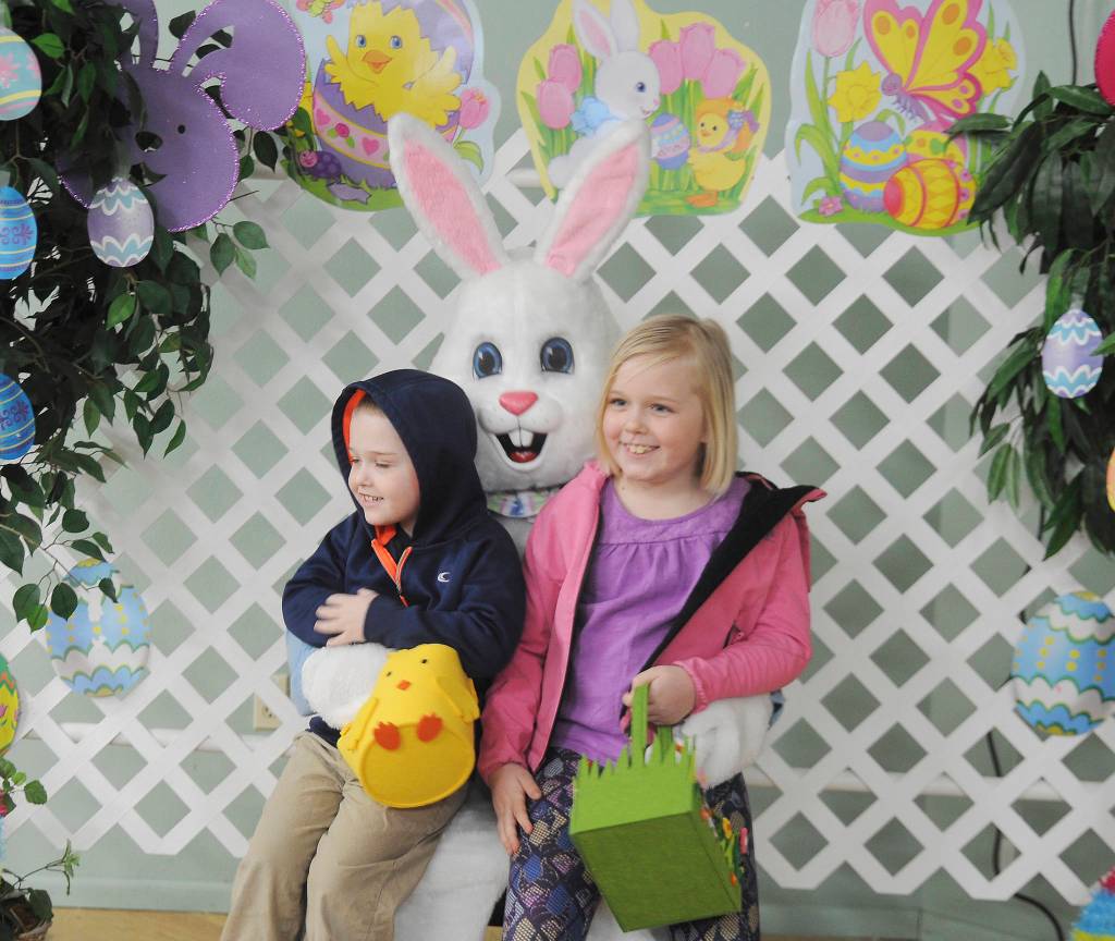 Owen Pickens, 4, and sister Olivia, 8, pose for a few photos with the Easter Bunny at the Sequim Elks Lodge on Saturday. Sequim Gazette photo by Michael Dashiell