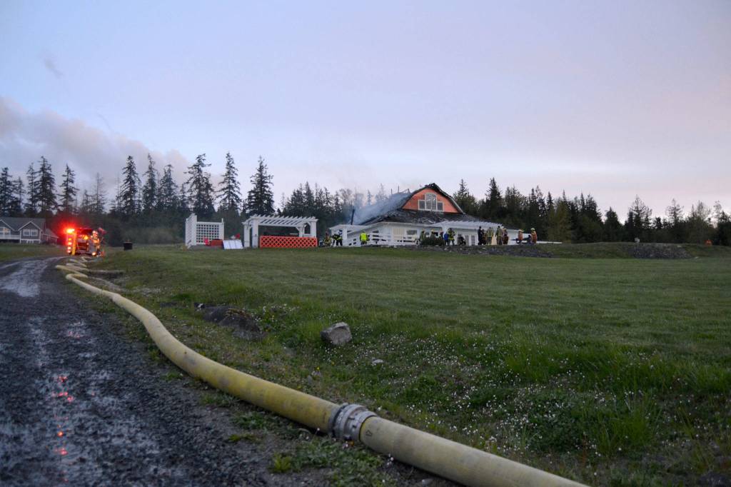 A cause for the fire in this Gardiner home remains under investigation, says fire officials with Clallam County Fire District 3. When fire crews responded on April 26, the attic was fully involved in flames. Sequim Gazette photo by Matthew Nash