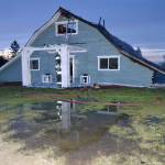 Port Ludlow Fire and Rescue firefighters look for hotspots on Friday night in a Gardiner home on the 2000 block of Old Gardiner Road. Sequim Gazette photo by Matthew Nash