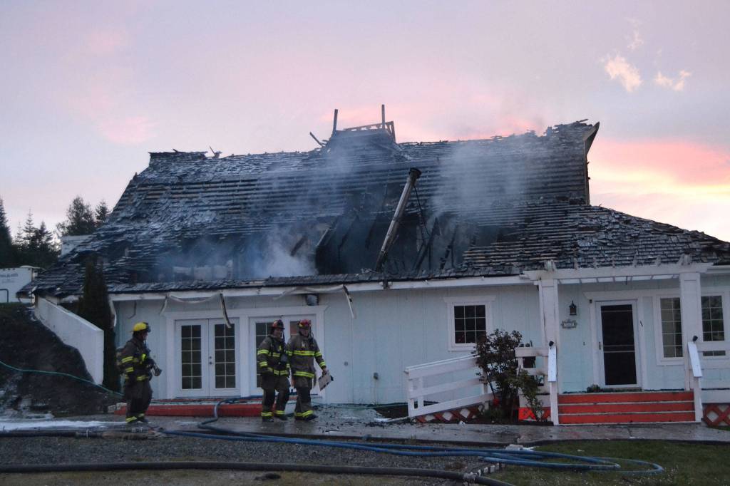A cause for the fire in this Gardiner home remains under investigation, says fire officials with Clallam County Fire District 3. When fire crews responded on April 26, the attic was fully involved in flames. Sequim Gazette photo by Matthew Nash