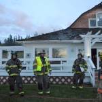 Fire Chief Ben Andrews with Clallam County Fire District 3 addresses firefighters from multiple agencies after they initially put out a fire in a Gardiner home on April 26. The fire rekindled early the next morning causing much of the remaining home to be lost, family members said. Sequim Gazette photo by Matthew Nash