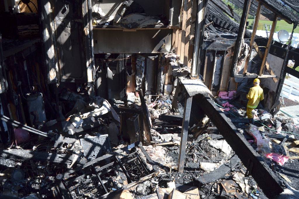 The southeast portion of this Gardiner home burned on Friday night and Saturday morning displacing four family members. Pictured here were two bedrooms on top of each other. Sequim Gazette photo by Matthew Nash