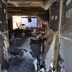 Some of the passageway into the home from this Gardiner homes backdoor was burned from an attic fire including two bedrooms and a family room. Sequim Gazette photo by Matthew Nash