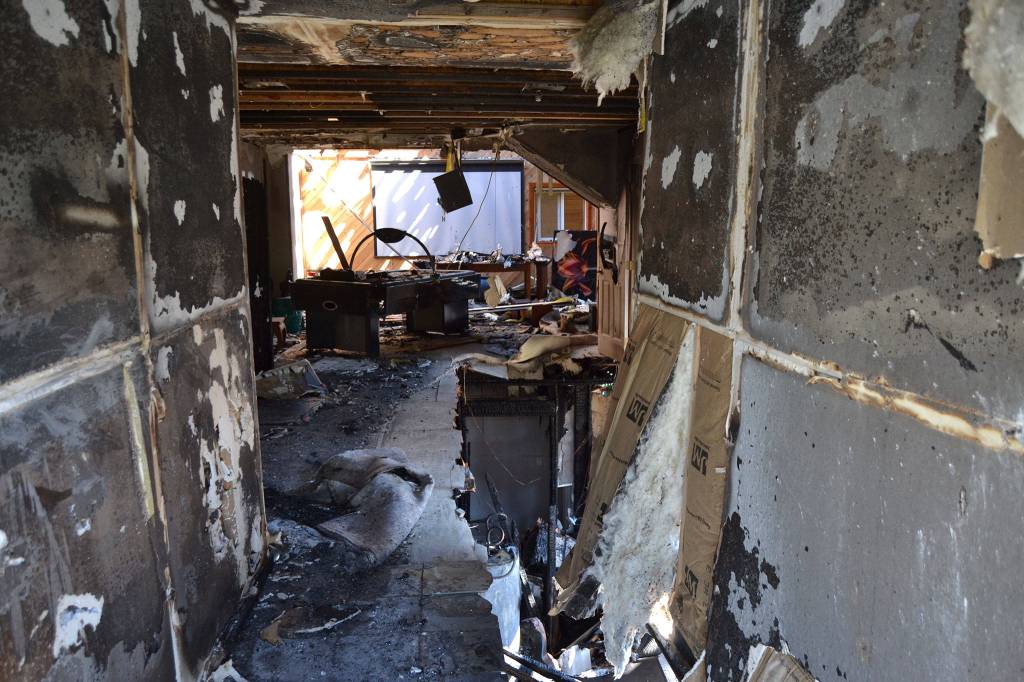 Some of the passageway into the home from this Gardiner homes backdoor was burned from an attic fire including two bedrooms and a family room. Sequim Gazette photo by Matthew Nash
