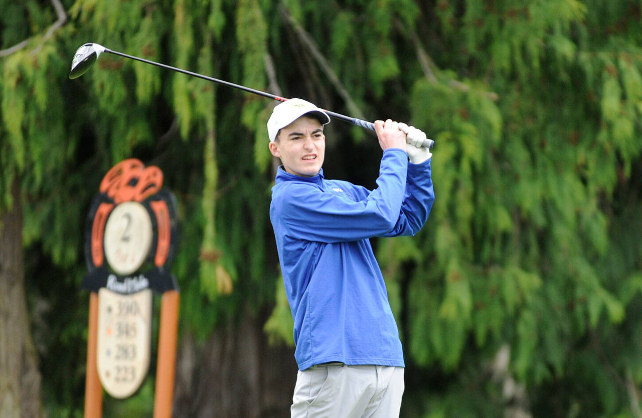 Sequims Paul Jacobsen watches a drive on the second hole at The Cedars at Dungeness. Jacobsens nine-hole round of 36 earned the junior medalist honors in a league win over North Kitsap on April 23, helping Sequim to a 9-0 league mark and fourth consecutive league title. Sequim Gazette photo by Michael Dashiell