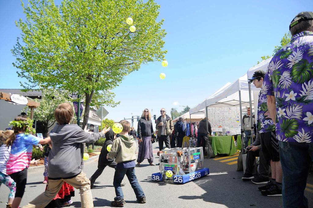 Members of the 2017 Sequim High School robotics team show off their bots ability to project into the air plastic balls at the Family Fun Day. Dozens of vendors and groups offer family friendly activities at Family Fun Day on May 4. Sequim Gazette file photo by Michael Dashiell