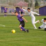 Mathys Tanche drives through North Mason players to help the Wolves win 7-0. Sequim Gazette photo by Matthew Nash