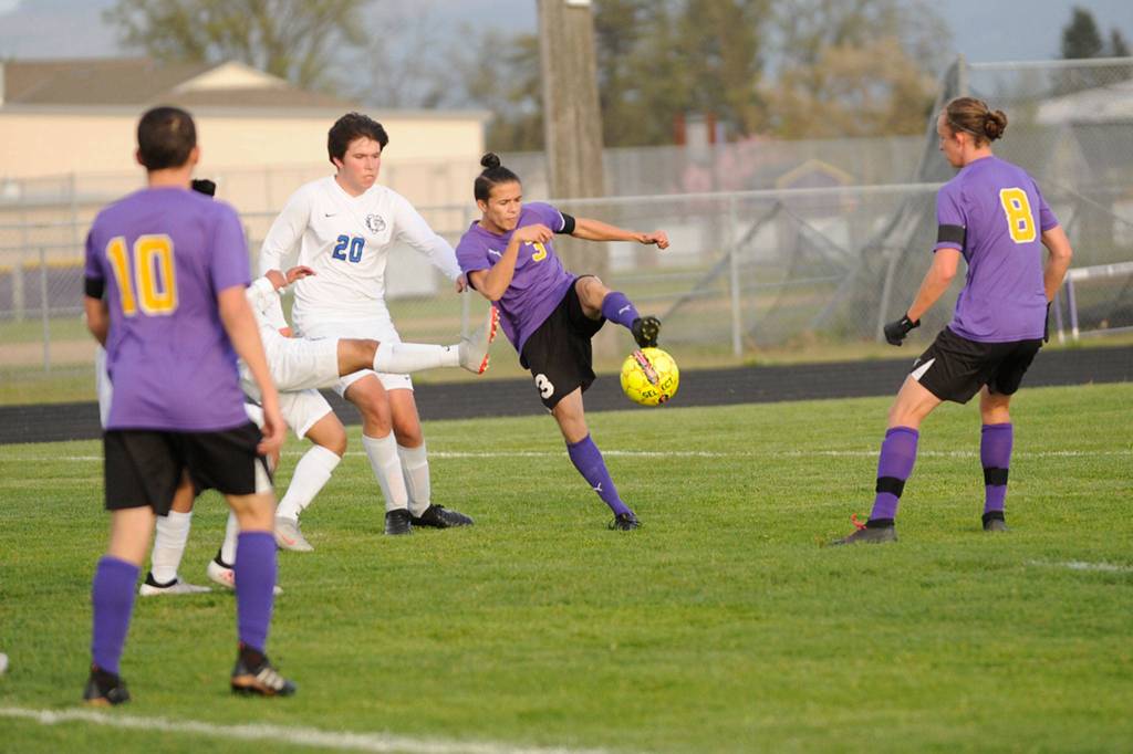 Sequims Ryan Tolberd looks to keep the ball in Sequims possession early in a 7-0 win on April 26. Sequim Gazette photo by Matthew Nash