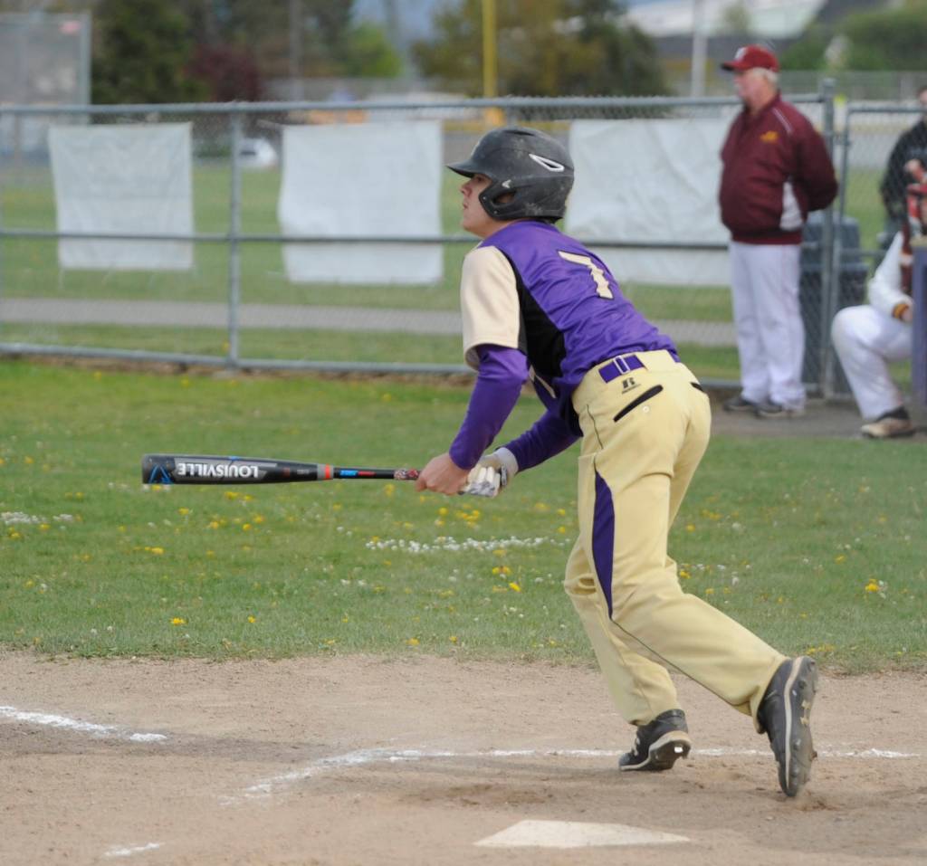 Sequim Highs Silas Thomas rips a single to center field in the Wolves Olympic league win over Kingston on April 26. Thomas paced the SHS offense with three RBIs and two runs scored, and finished the week with six RBIs. Sequim Gazette photo by Michael Dashiell