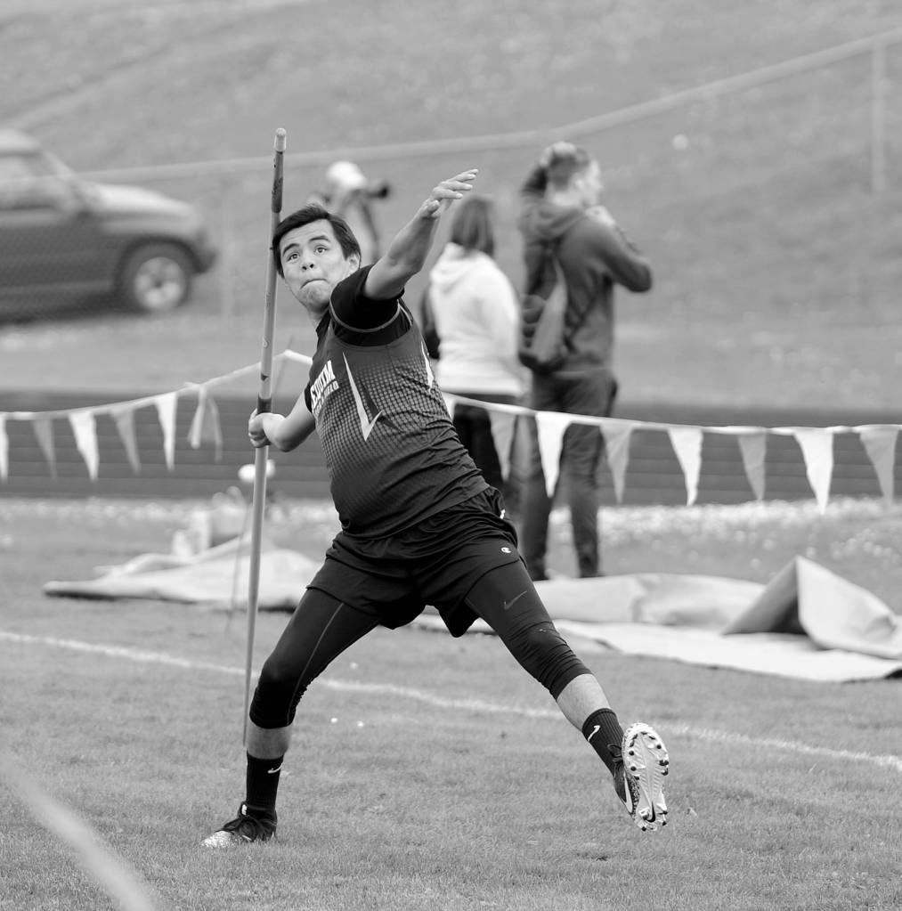 Sequim senior Rigo Langston hurls a personal best 135-foot 9-inch throw in the javelin to place second behind teammate Riley Cowan at a league meet last week in Port Angeles. Sequim Gazette photo by Michael Dashiell