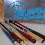 Several finished Tsunami Bat Company bats on display with the Sequim companys sign. Sequim Gazette photo by Conor Dowley.