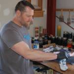 Gary White applies the dye to a Tsunami Bat. Sequim Gazette photo by Conor Dowley