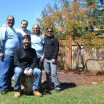 From left, volunteers Manny Aybar, executive director of ORCA, Our Community Resiliency Alliance, Krista Baker, Keith Sandell, youth pastor for Sequim Community Church, Cassidy Crecelius and Brittany Van Ness stand together after completing a prayer garden at the future home of ORCAs site for women and families facing crisis and trauma. Sequim Gazette photos by Matthew Nash