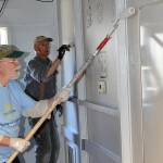Mark McGriff, on left, with the Sequim Worship Center, and Al Bierlink with Sequim Community Church, help paint a classroom at Olympic Peninsula Academys new portables as part of Sequim Beautiful Day, a community effort to provide service. Sequim Gazette photo by Matthew Nash
