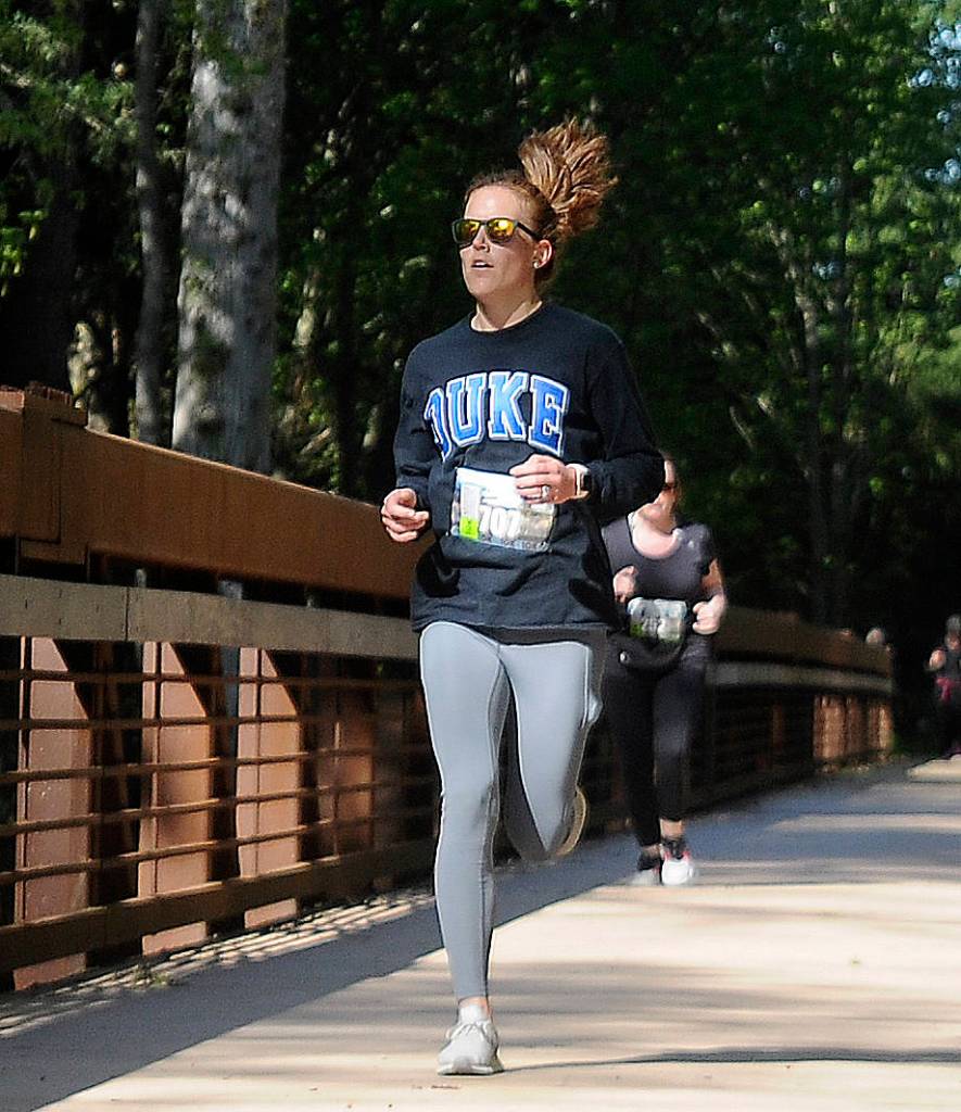 Marisa Zahn of Bremerton takes top honors in the female division of Saturdays Railroad Bridge 10k, placing fourth overall in 42:20. Laura Gould of Sequim was second (44:05). Sequim Gazette photo by Michael Dashiell