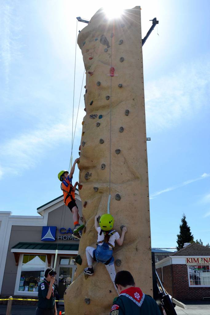 Children lined up throughout May 4s Family Fun Day to climb the wall courtesy of BSA Scout Troop 1498, Venture Troop 2223 and Cub Scout Pack 4850. Sequim Gazette photo by Matthew Nash