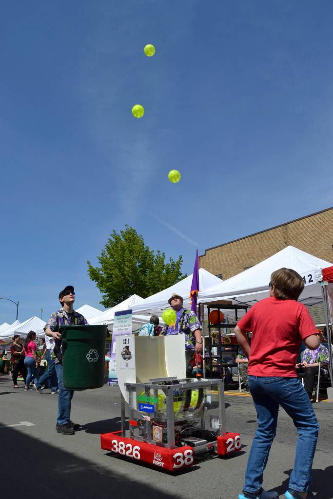 Josh King, 17, and Jackson Lindorfer, 16, with the Sequim Robotics Federation prepare to catch whiffle balls from the Sequim High School Robotics Teams 2017 robot. This year, team members said they took 24th out of more than 200 teams at Washingtons state tournament. Sequim Gazette photo by Matthew Nash