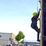 Ayat Awawdeh, 9, of Sequim, climbs high on the wall provided by Sequim Scout troops and packs during the Family Fun Day. Children lined up throughout May 4 to climb courtesy of BSA Scout Troop 1498, Venture Troop 2223 and Cub Scout Pack 4850. Sequim Gazette photo by Matthew Nash