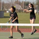 Sequims Arlene Law, right, returns a volley as she and doubles partner Amanda He take on a Kingston doubles team in March. Law and He survived a three-set battle in the opening round of the Olympic League tournament on May 9, coming back from a 5-1 deficit in the third set to win the next six points. Sequim Gazette file photo by Michael Dashiell