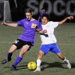 Sequims Brandon Wagner, left, and David Baltazar of Washington battle for control in the second half of Sequims 4-2 district playoff win on May 7. Sequim Gazette photo by Michael Dashiell