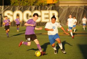 Sequims Reid Parker, left, and Ariano Taitague Chavez vie for possession in the first half of a May 7 West Central District playoff match-up. Sequim Gazette photo by Michael Dashiell