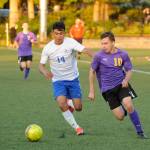 Sequims Mathys Tanche, right, drives deep into Washington territory in the Wolves 4-2 district playoff win on May 7 in Port Angeles. Pursuing the play is Washingtons Obed Lemus. Tanche had Sequims fourth goal of the game and lone second half score. Sequim Gazette photo by Michael Dashiell