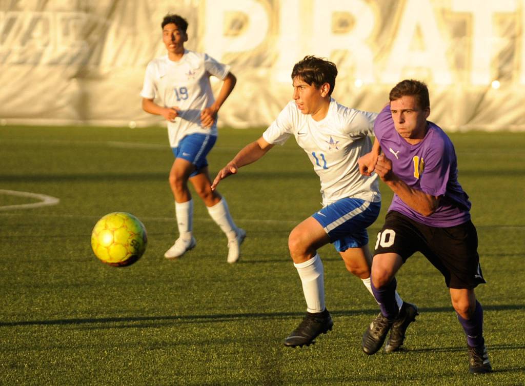Sequims Mathys Tanche, right, drives deep into Washington territory in the Wolves 4-2 district playoff win on May 7 in Port Angeles. Tanche had Sequims fourth goal of the game and lone second half score. Pursuing the play is Miguel Plancarte (11) and Saul Talavera (19). Sequim Gazette photo by Michael Dashiell