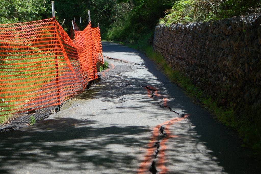 This section of the Olympic Discovery Trail near milepost 26 has been slowly sliding for five years, and riders are finding less and less safely-navigable trail to use. Sequim Gazette photo by Conor Dowley.