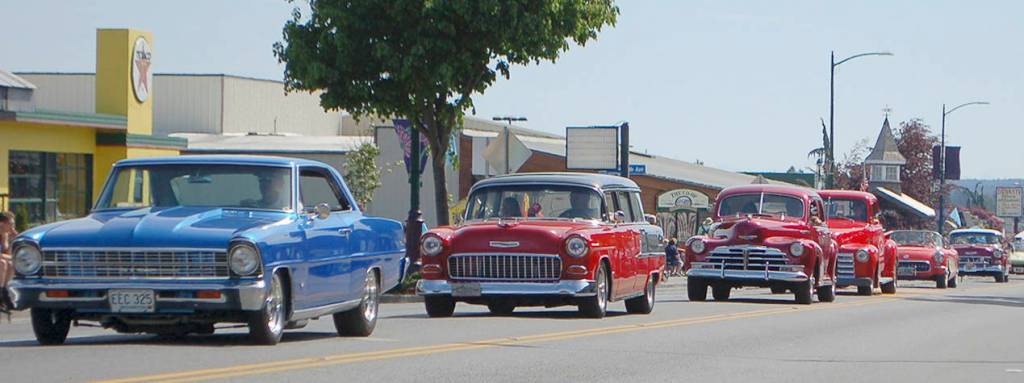 A variety of classic, restored, and customized cars make their way down Washington Avenue as part of the annual Car Cruzz during the 2019 Irrigation Festival. Sequim Gazette photo by Conor Dowley