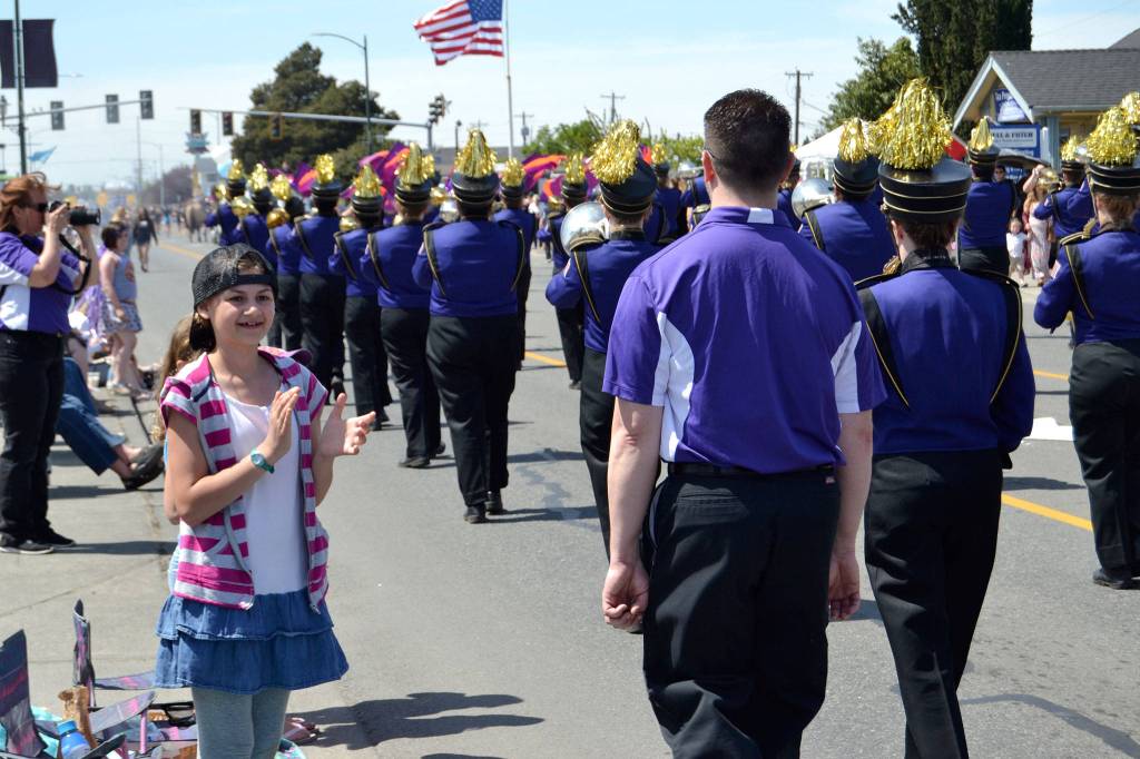 Adeline Fobian, 11, of Port Angeles, cheers for one of the many bands during the Irrigation Festivals Grand Parade. Sequim Gazette photo by Matthew Nash