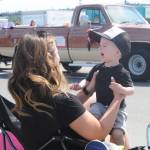 Ellis Hueter and mom Meghan enjoy the Sequim Irrigation Festival Grand Parade on May 11. Sequim Gazette photo by Michael Dashiell