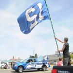 Dalton Ross of Port Angeles waves his 12th Man flag as the Dungeness Seahawkers group passes by during the Sequim Irrigation Festival Grand Parade on May 11. Sequim Gazette photo by Michael Dashiell