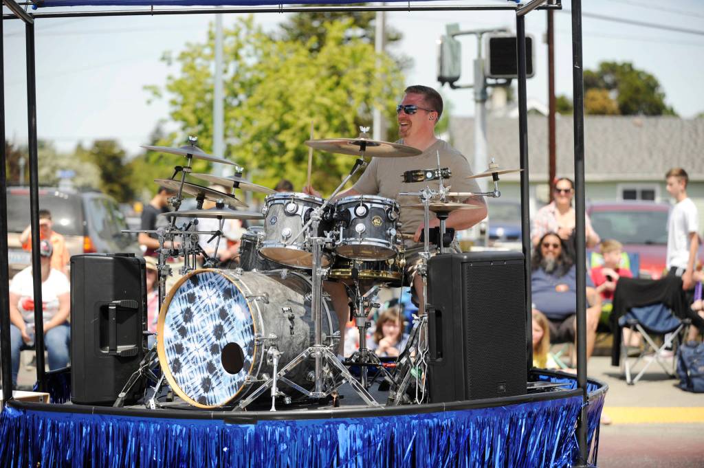 Michael Echternkamp  aka Sequims Rockin Realtor  plays for the Irrigation Festival Grande Parade crowd. Sequim Gazette photo by Michael Dashiell