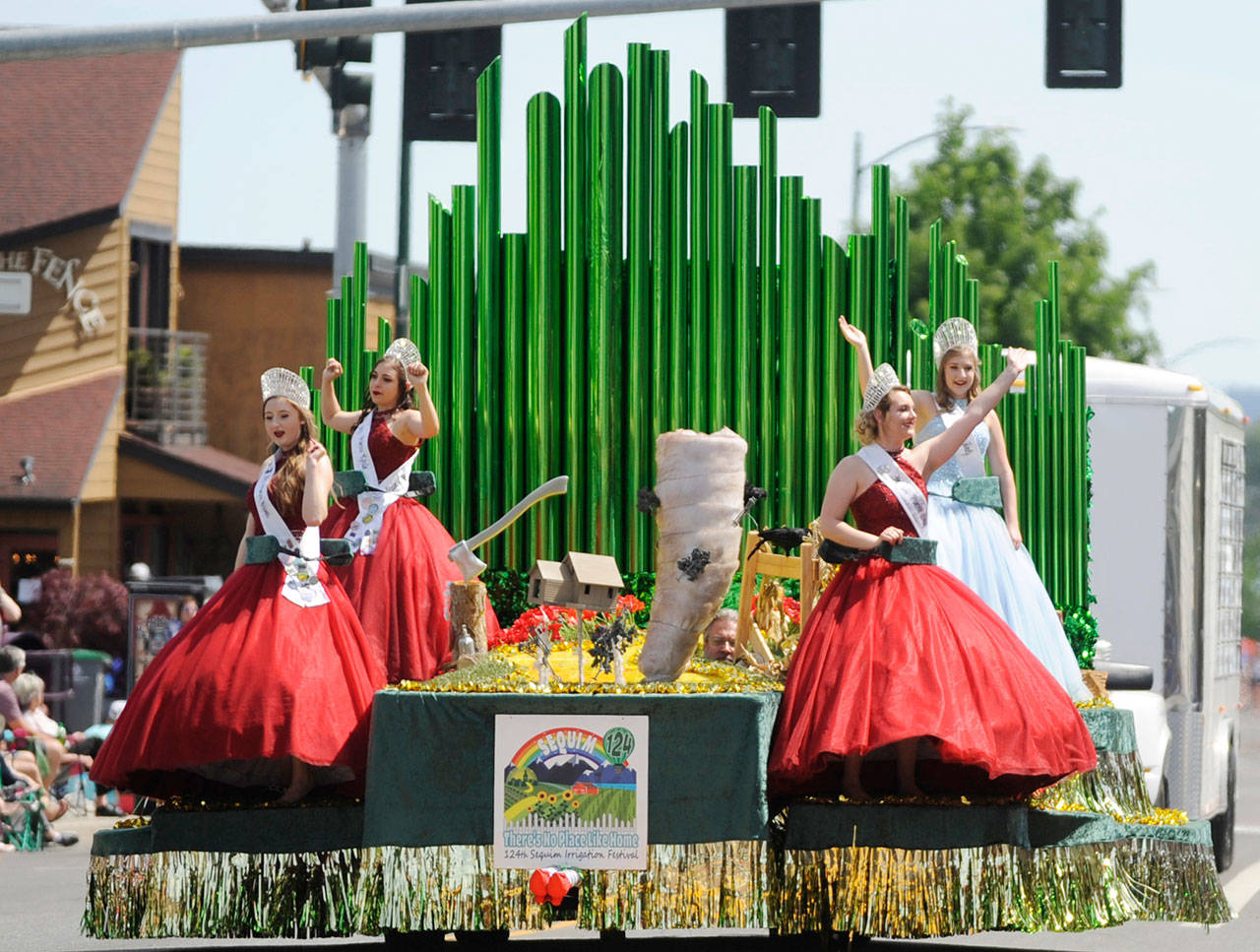 Sequim Irrigation Festival royalty  from left, princesses Brianna Cowan, Kjirstin Foresman and Shelby Wells and queen Emily Silva  wave to an adoring crowd at the 2019 Grand Parade on May 11. Sequim Gazette photo by Michael Dashiell