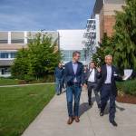 U.S. Rep. Derek Kilmer, left, and Olympic Medical Center CEO Eric Lewis walk through OMCs Sequim Campus on Saturday. Kilmer recently introduced legislation that aims to halt a new policy from the Centers for Medicare and Medicaid Services that cuts Medicare reimbursements by up to 60 percent for multi-campus hospitals, such as OMC. Photo by Jesse Major/Peninsula Daily News