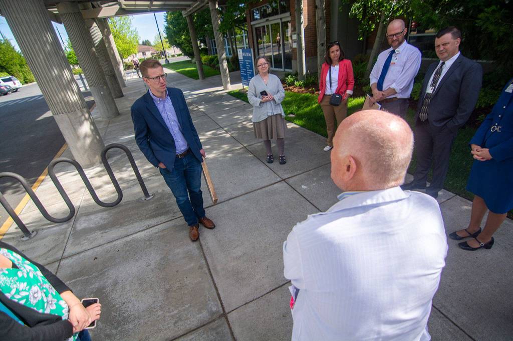 Kilmer, left, talks with Olympic Medical Center staff Saturday after touring OMCs Sequim campus. (Jesse Major/Peninsula Daily News)