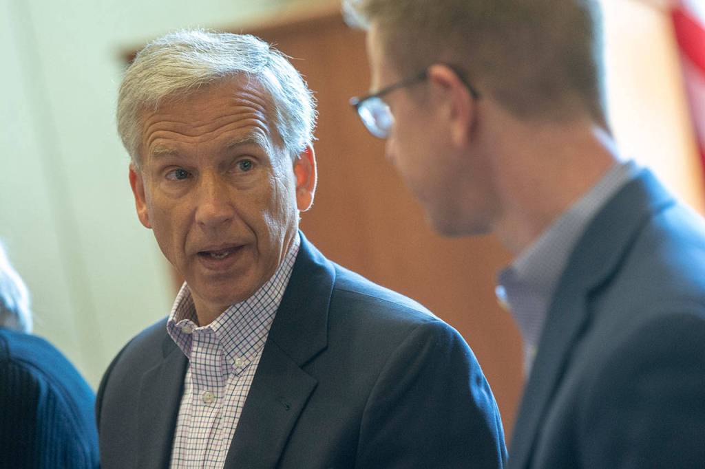 Olympic Medical Center CEO Eric Lewis tells Kilmer of the impacts the Centers for Medicare and Medicaid Services cuts to Medicare reimbursements will have on the hospital. (Jesse Major/Peninsula Daily News)