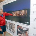 7 Cedars Casino CEO Jerry Allen looks at an artists rendering of the casinos new resort hotel curently under construction. (Keith Thorpe/Peninsula Daily News)