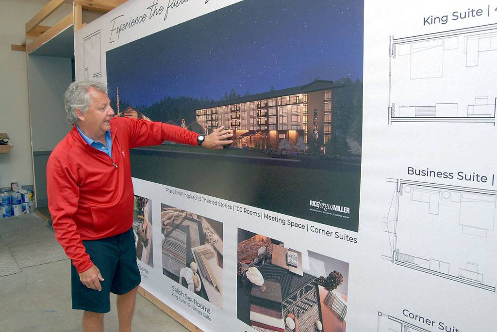 7 Cedars Casino CEO Jerry Allen looks at an artists rendering of the casinos new resort hotel curently under construction. (Keith Thorpe/Peninsula Daily News)