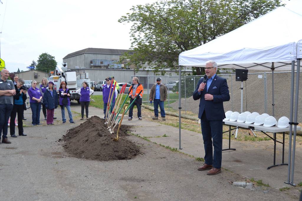 Gary Neal, Sequim Schools superintendent, told a crowd of about 40 people on May 16 that its good luck when it sprinkles on a project. He and other dignitaries held a ceremonial groundbreaking for the West Fir Street Rehabilitation Project. Sequim Gazette photo by Matthew Nash
