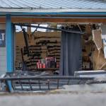 Heavy equipment was used to break into FREDS Guns in April, causing the damage seen here in this file photo. (Jesse Major/Peninsula Daily News)