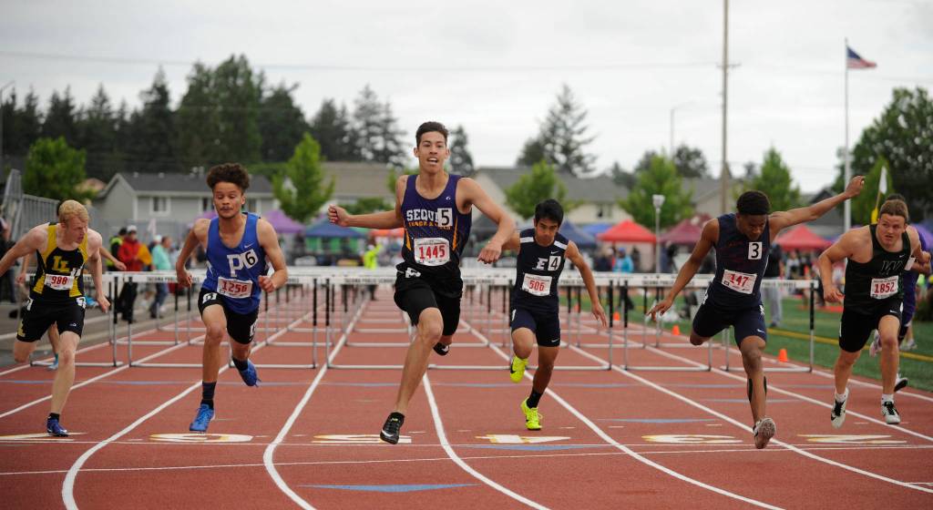 Sequim High senior Riley Martin takes second  by 0.001 of a second  in the 110-meter high hurdles at the state 2A track and field championships in Tacoma on May 24. Sequim Gazette photo by Michael Dashiell