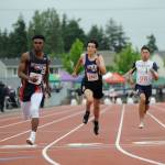 Sequim High junior Darren Salazar, center, earns a spot in the 100-meter finals at the state 2A track and field championships in Tacoma on May 24. Salazar went on to earn two individual medals, placing fifth in the 200 and sixth in the 100. Sequim Gazette photo by Michael Dashiell