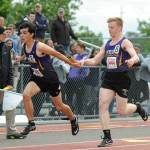 Sequims Logan Laxson, right, hands off to teammate Darren Salazar in the 4x100 relay preliminaries at the state 2A track and field championships in Tacoma on May 24. Sequim placed seventh in the race and advanced to the finals, where they took sixth. Sequim Gazette photo by Michael Dashiell