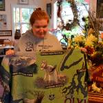 When she wore an antique dress in lavender fields, Kelly Yarnes was known as The Lavender Lady. Her likeness has appeared on blankets, post cards, magnets and more. Now her name goes up on a sign outside of Sequim for winning a gold medal at the 1988 International German American Special Olympics. Sequim Gazette photo by Matthew Nash