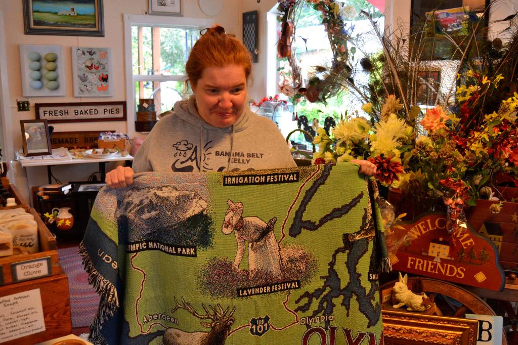 When she wore an antique dress in lavender fields, Kelly Yarnes was known as The Lavender Lady. Her likeness has appeared on blankets, post cards, magnets and more. Now her name goes up on a sign outside of Sequim for winning a gold medal at the 1988 International German American Special Olympics. Sequim Gazette photo by Matthew Nash